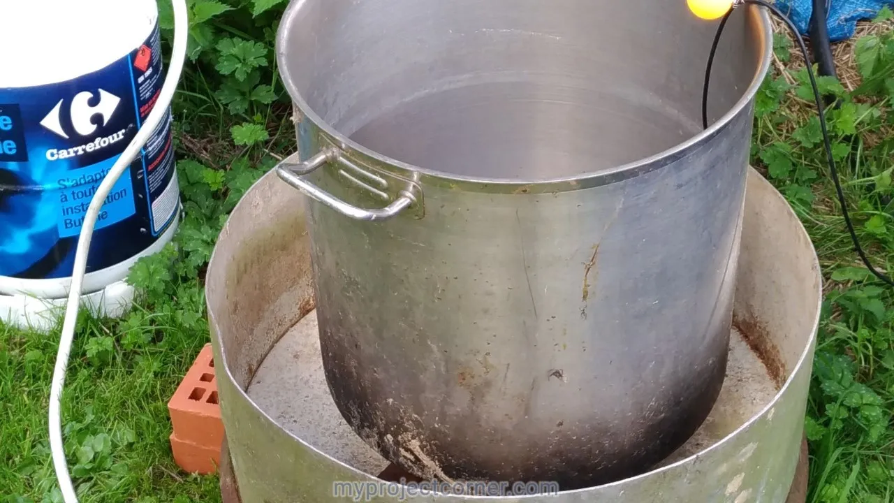 the chicken scalding pot on a gas burner