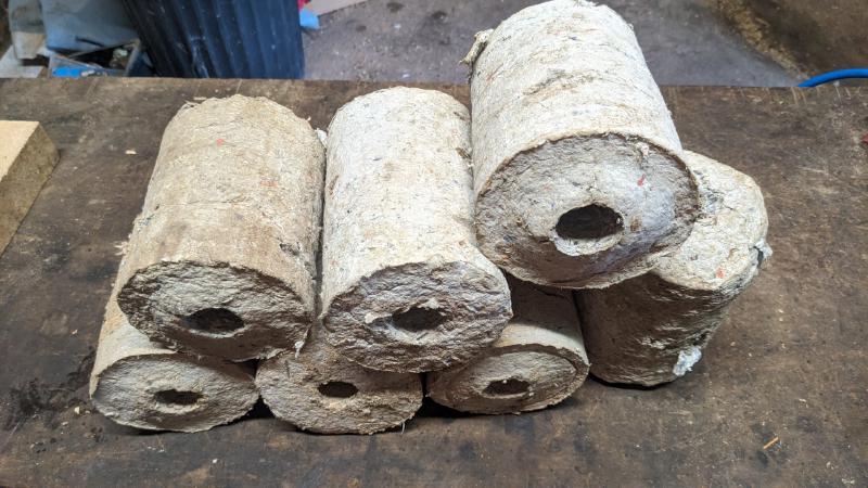 compressed paper and sawdust logs
