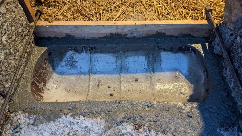 gas bottle feeding trough set in concrete