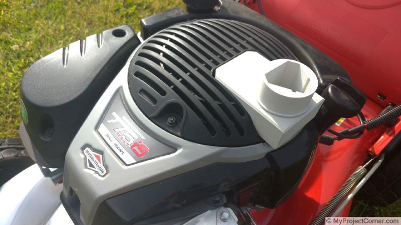The Briggs & Stratton Lidl battery adaptor on the lawnmower